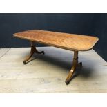Regency style crossbanded satinwood oblong low occasional table on splayed legs & brass castors,