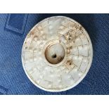 Chinese white jade circular carving of a dragon, 7cm dia