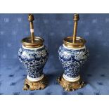 Pair of blue and white Delft vase shaped ormolu table lamps, 30cmH