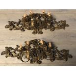 Pair of old Regency style gilded wall light sconces, surmounted on a Rococo acanthus back, 90cmL