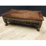 Chinese hardwood rectangular low table with a scrolling carved frieze, 77Lx41Wx27Hcm