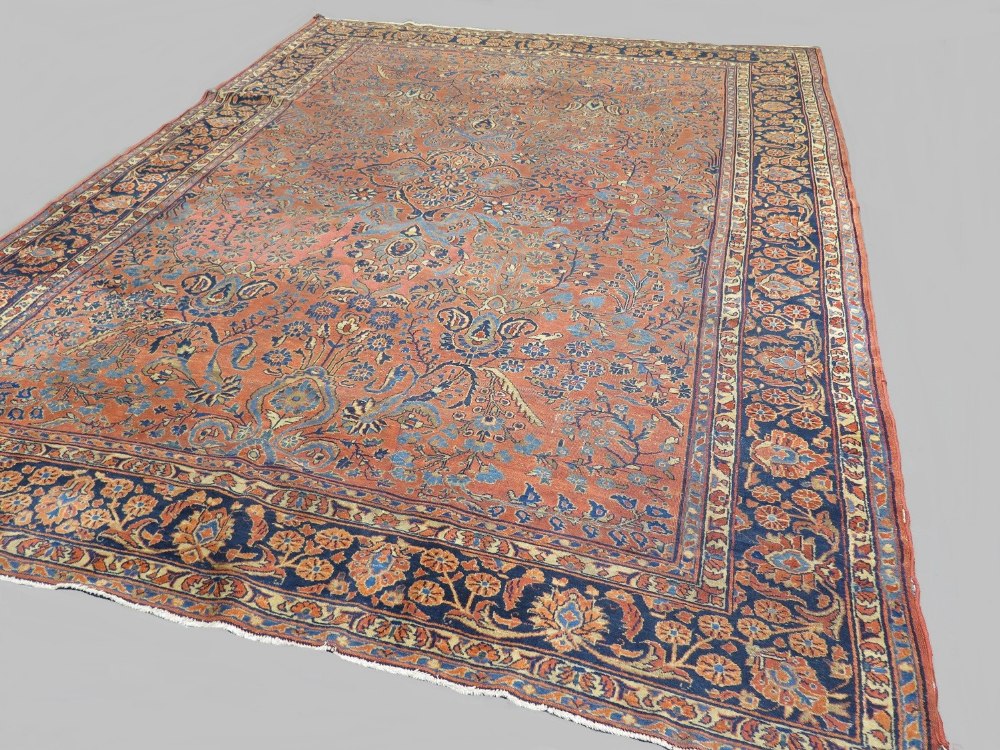 Fine antique Persian Sarouk carpet, circa 1890, in all over floral and geometric patterns of browns,