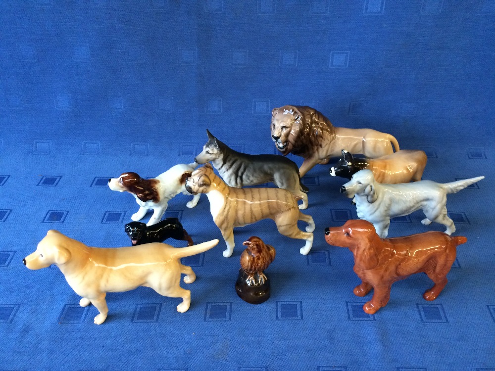 7 Beswick dogs, a lion, Jersey bull and Bell's whisky (10)