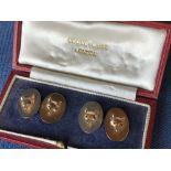 Fine pair of 9 carat gold oval cufflinks embossed with fox masks set with ruby eyes, 7.5g, in Swaine