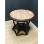 Chinese hardwood circular marble topped centre table with a folding hexagonal ribbed base, 95cm