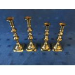 2 similar pairs of antique brass candlesticks