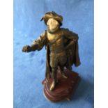 A bronze figure of a Musketeer with sword & ivorine face on a marble & ormolu stand, 27cmH