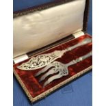 Cased pair of Continental silver fish servers