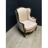 French style large winged back armchair with walnut frame and checked fabric