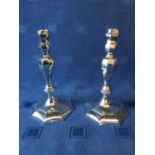 Pair of hallmarked silver cast candlesticks in early Georgian style by Richard Comyns of London