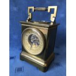 Brass mantle clock with skeletonised striking movement, the top with a barometer, 22cmH