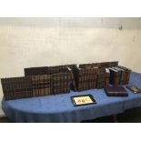 Quantity of book holders decorated with faux leather book bindings, leather bound bridge box etc