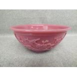 Chinese pink glass bowl with raised floral and bird decoration 7Hx16Dia cm