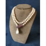 Silver and freshwater pearl necklace with snake clasp inset with rubies