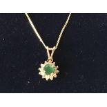 14 carat yellow gold, emerald and diamond pendant necklace on gold chain