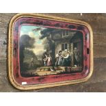 C19th tole oblong tray decorated with a scene of figures outside a cottage, with a glass top,