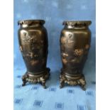 Pair of Japanese bronze vases with embossed decoration of birds & flowers, 33cmH