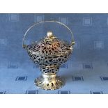 Early Victorian hallmarked silver pierced fretwork bon bon basket with swing handle, ruby glass