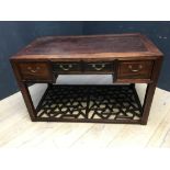 Chinese hardwood desk of 4 drawers above an open geometric under shelf, 124Lx67Wx76Hcm