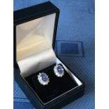 Pair of 18 carat white gold, sapphire and diamond cluster earrings, 3.5 carats total weight