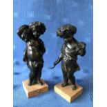 Pair of bronze cherubs at harvest on marble stands, 22cmH