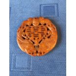 Chinese soapstone pendant with carved bat & carp decoration, 6cm dia