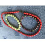 Chinese green bead bangle, another & a red bead necklace