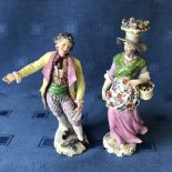 Pair of Continental ceramic figurines of a lady & gentleman, blue marks to base, 20/22cmH