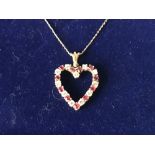 14 carat yellow gold, ruby and diamond heart shaped pendant necklace on gold chain
