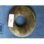 Chinese carved green jade circular pierced disk, 8cm dia