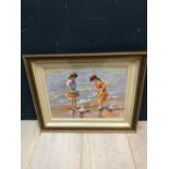 A gilt framed oil painting portrait of 2 girls on a seashore with toy sail boats, 30x40cm