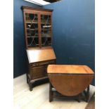 Pine oval drop-leaf gate leg dining table and Edwardian mahogany bureau bookcase