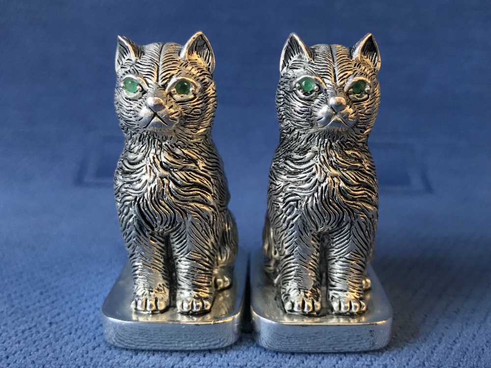Pair of cat condiments stamped 800 Continental silver with emerald eyes