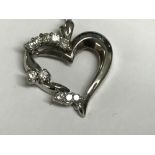 14 carat white gold heart shaped diamond set pendant necklace on gold chain