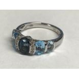 14 carat white gold, blue topaz & diamond ring