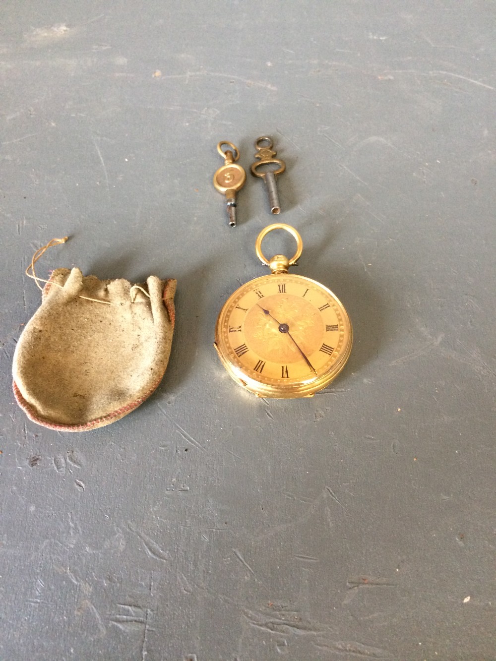 18 carat gold engraved pocket watch with key