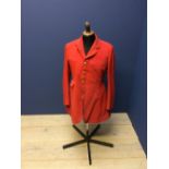 Red hunt coat with brass hunt buttons