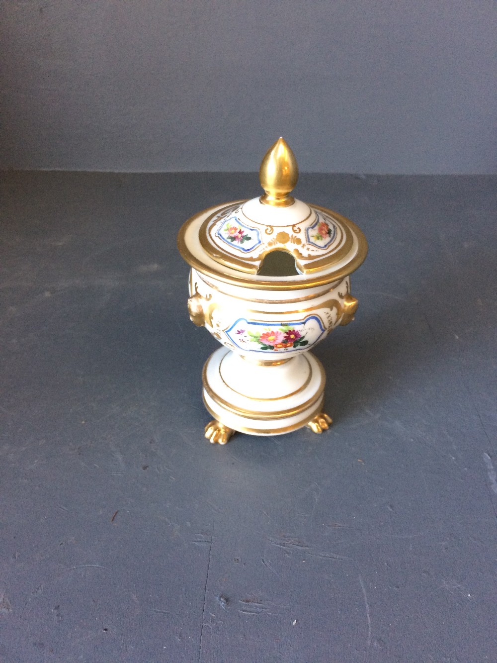 Small porcelain French condiment pot with gilt and floral decoration, 14cmH