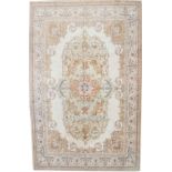 Rare Tabriz carpet, signed Benlian, Persia, with cream ground and delicate floral and leaf scroll