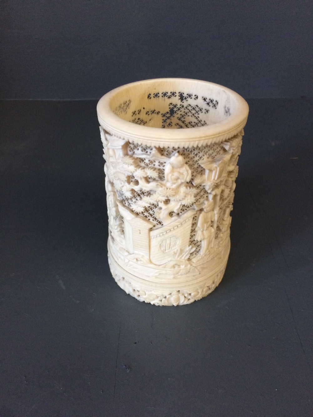 C19th delicately carved ivory Chinese brush pot, pierced work with figures, buildings & trees,