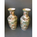 Pair of Chinese crackleware vases, heavily decorated with figures