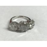 Impressive 18 carat white gold three stone diamond ring of 7.1 carats, Si