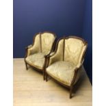 Pair of carved walnut/beech framed fauteuils with upholstered back & seat on stop fluted legs