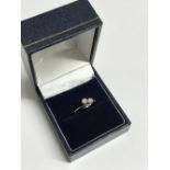 18 carat yellow gold, two stone diamond crossover ring