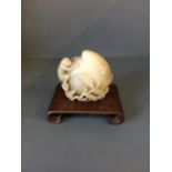Carved jade peach with monkey on wooden stand, 11cmH