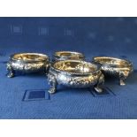 Set of 4 embossed hallmarked silver salts with lion mask and paw feet, 18 ozt
