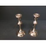 Pair of hallmarked silver circular candlesticks, Birmingham 1973, 18cmH