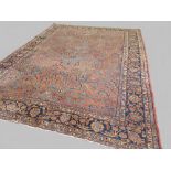 Fine antique Persian Sarouk carpet, circa 1890, in all over floral and geometric patterns of browns,