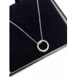 14 carat white gold diamond pendant necklace on a gold chain
