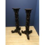Pair of Chinese hardwood pedestals, profusely carved with mythical beasts & elephants on 3 Fo dog